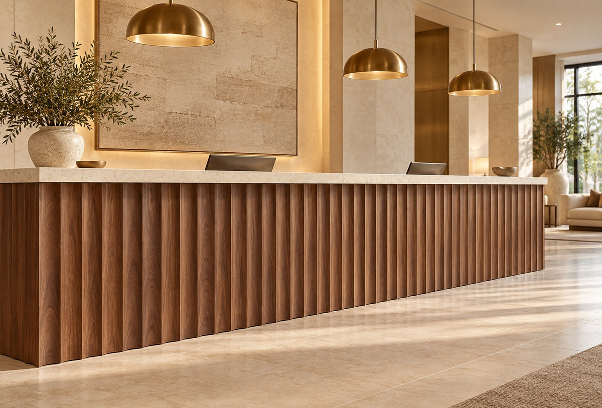 Hotel reception counter fronted with natural walnut scalloped wall panels