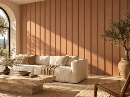 Living room with terracotta grooved wall panels behind a cream sofa