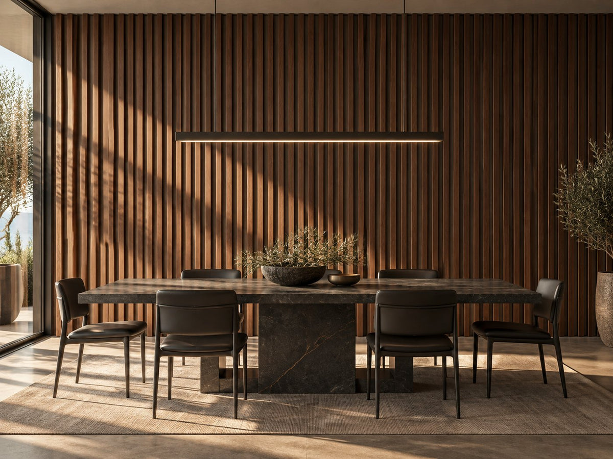 Dining room with walnut grooved wall panels behind a stone dining table